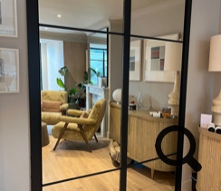 Hidden bookcase door with mirror